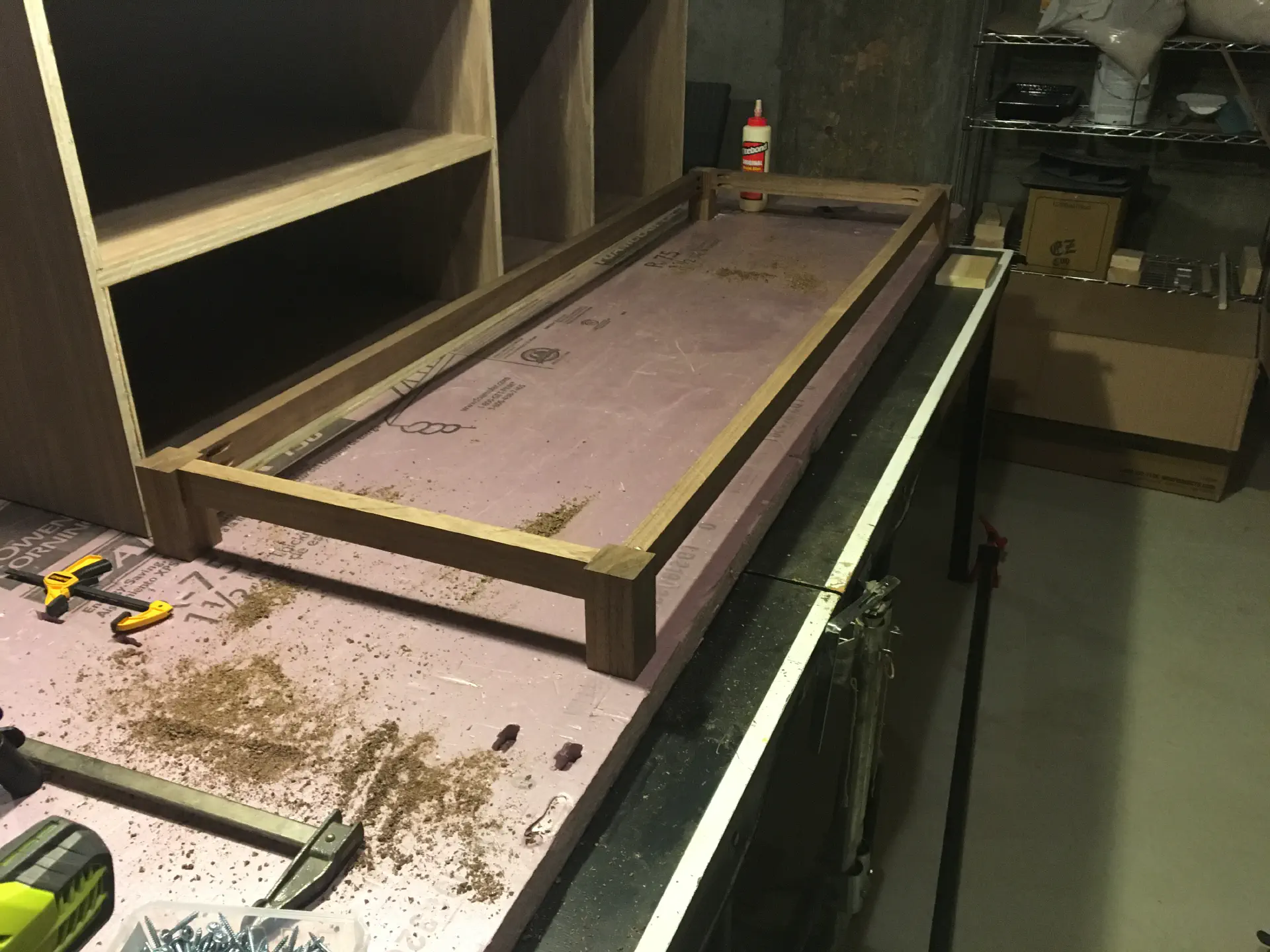 Using pocket holes, the apron is assembled and sitting next to the glued cabinet