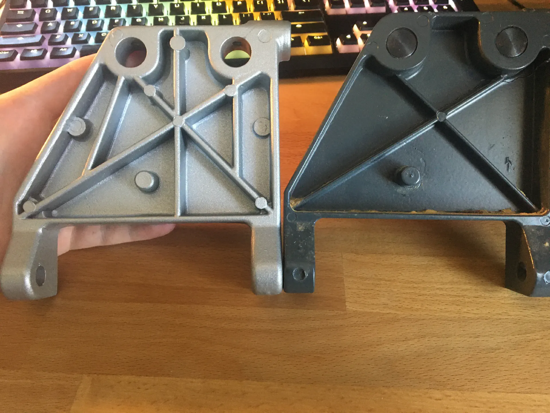 A cracked motor mount bracket and a new re-inforced one from SawStop