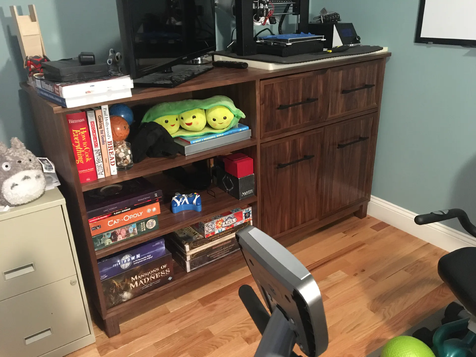 Picture of the fully loaded cabinet with far too much on it