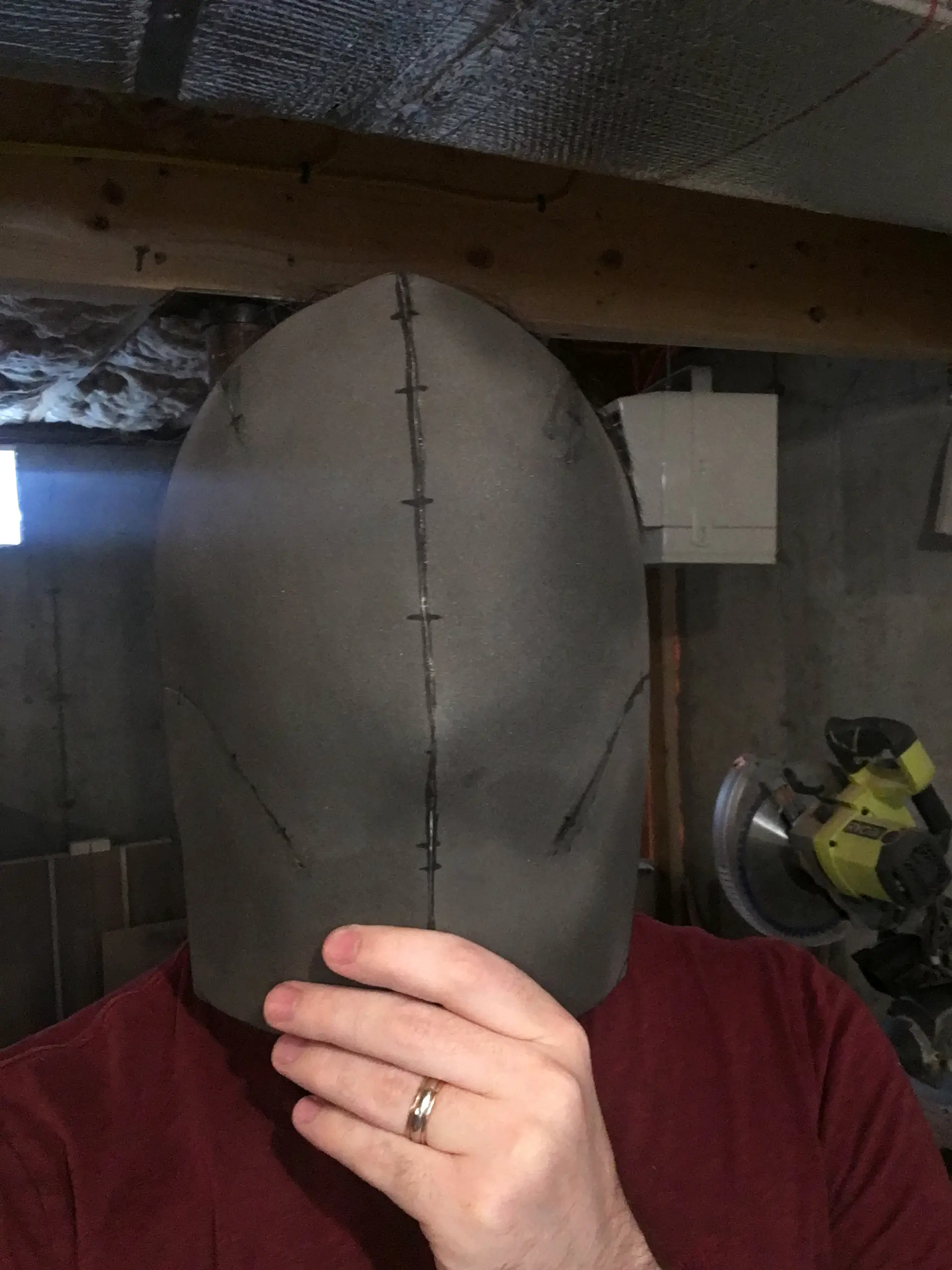 Very basic foam mask form, no eyes or anything. Just a full face covering.