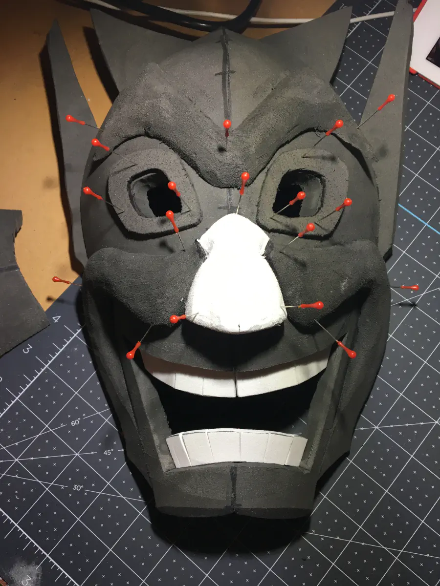 Using some white EVA foam, a nose and teeth are cut out.