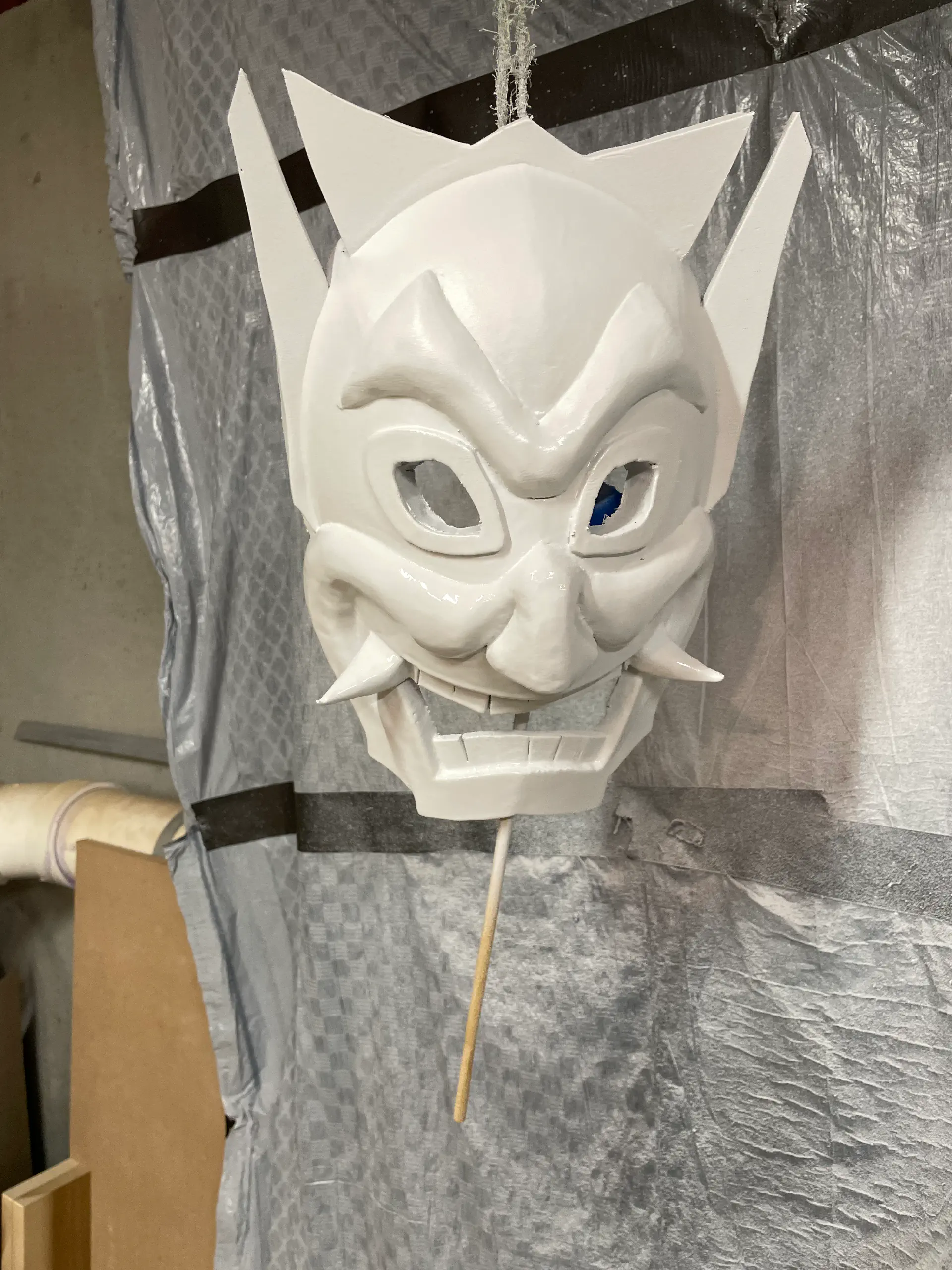 Second coat of PlastiDip. The mask is now all white.