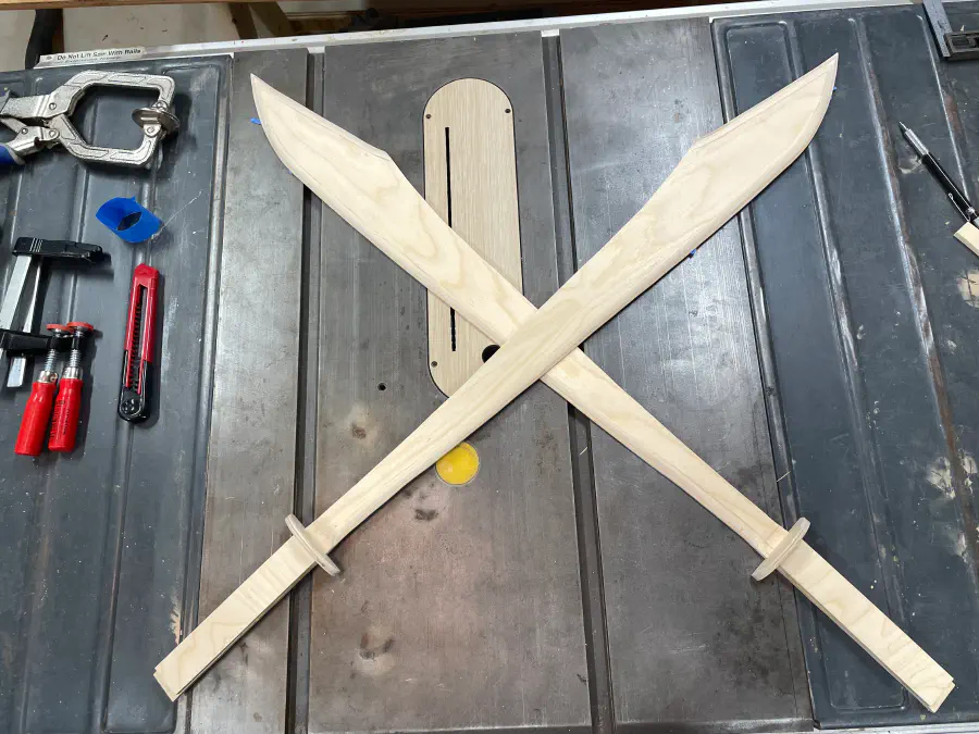Crossed swords again, but with a plywood guard.